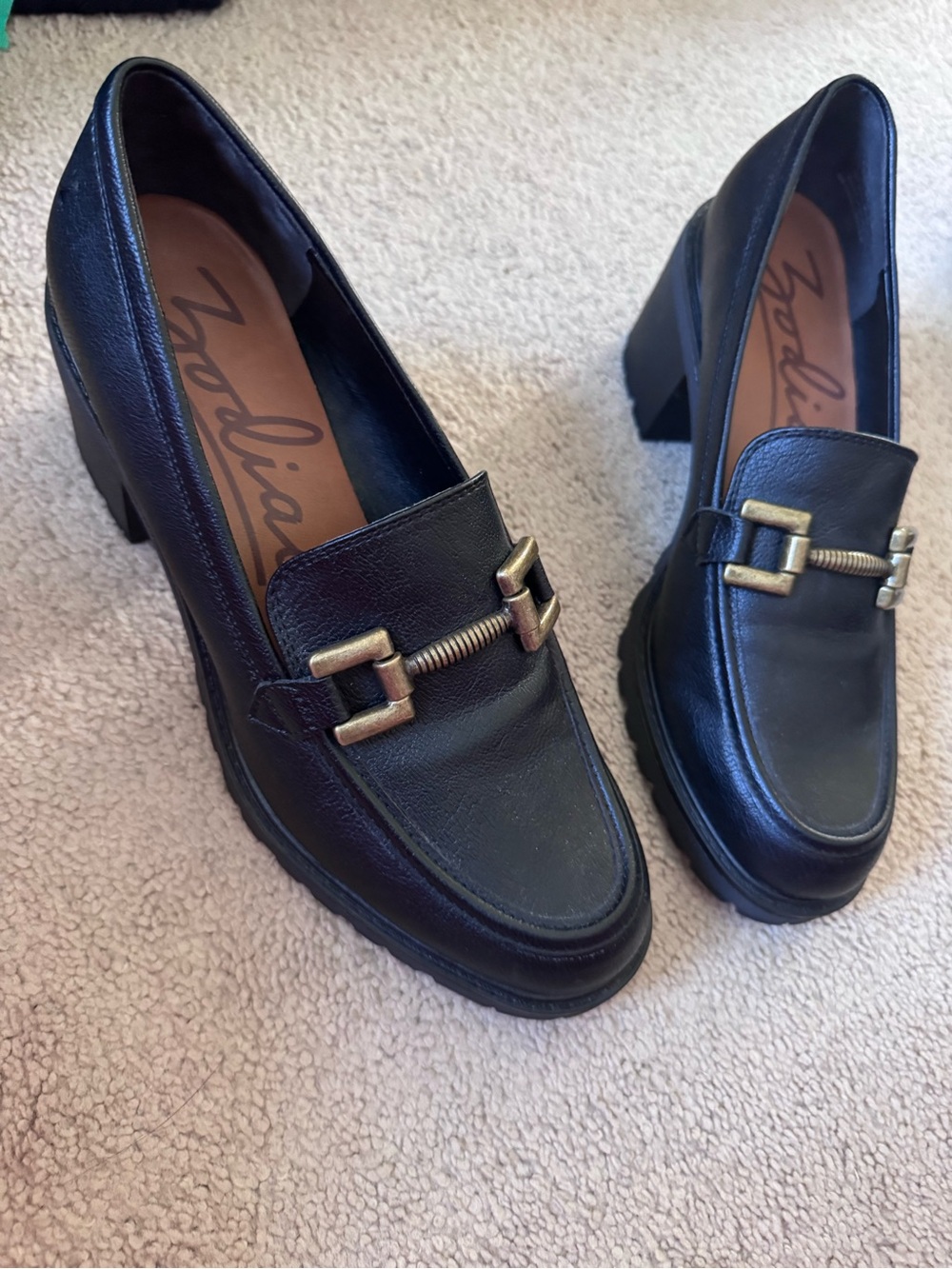 Zodiac Black Leather Heeled Loafers with Gold Buckle